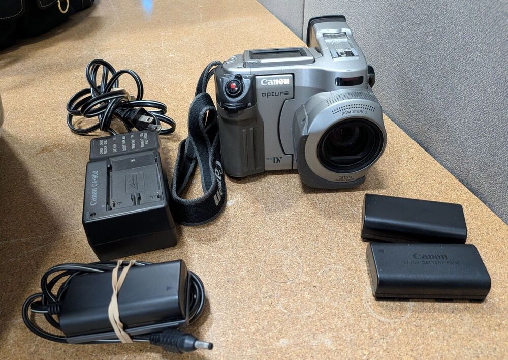 2003 Canon Optura Camcorder Bundle With Two Batteries & Charger With Dc Coupler